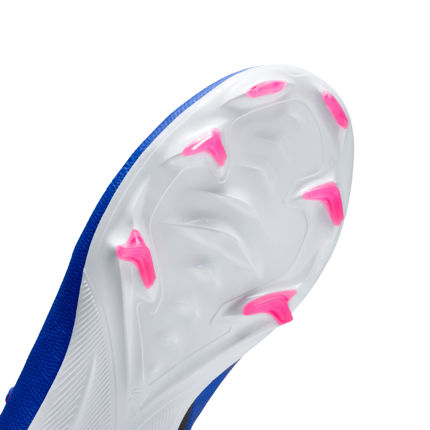 Close-up of the white soleplate of a blue soccer cleat, featuring bright pink chevron-shaped studs against a black background.
