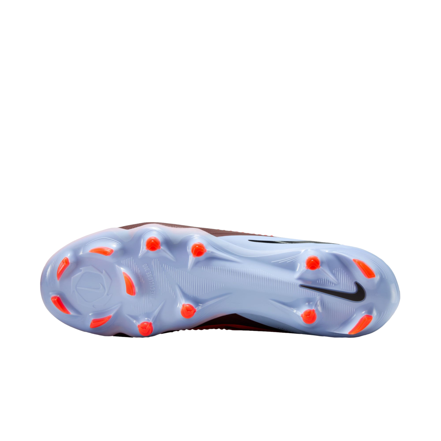 Underside view of a light blue Nike soccer cleat with bright orange studs and a black Nike swoosh, set against a black background.