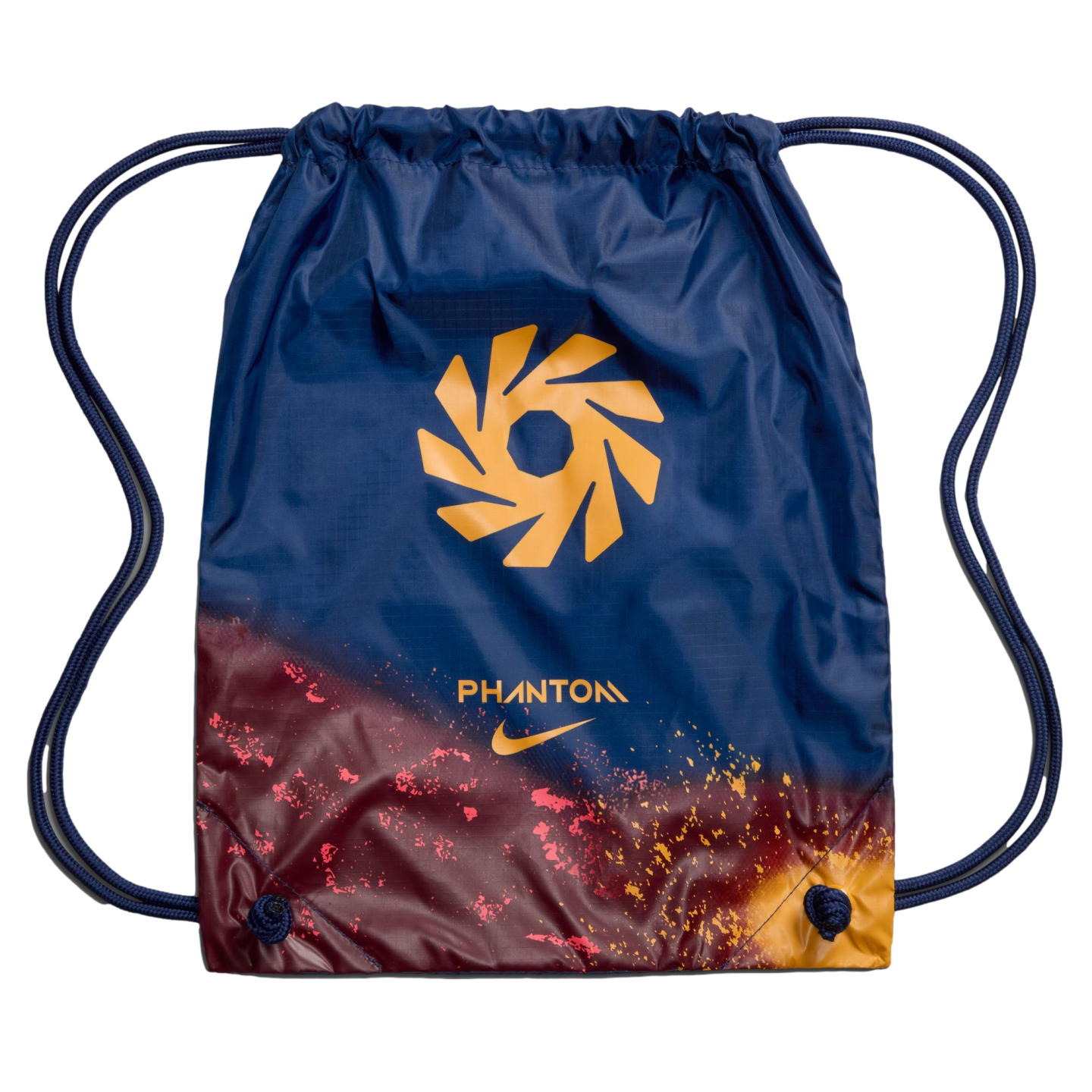 A navy blue Nike Phantom drawstring bag with a gold geometric logo and a maroon and orange speckled gradient design at the bottom.