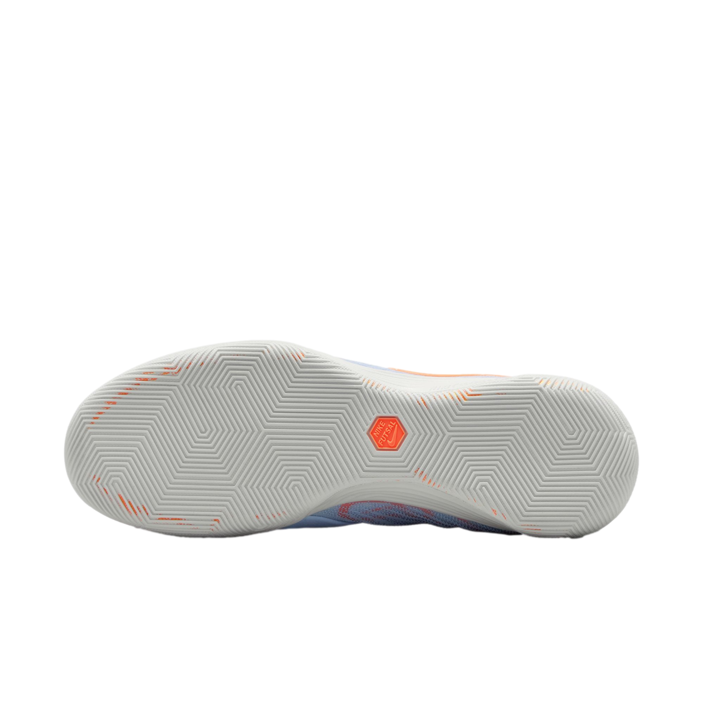 A bottom view of a Nike Futsal shoe showing a light grey rubber outsole with a geometric zig-zag traction pattern and an orange hexagonal logo in the center.