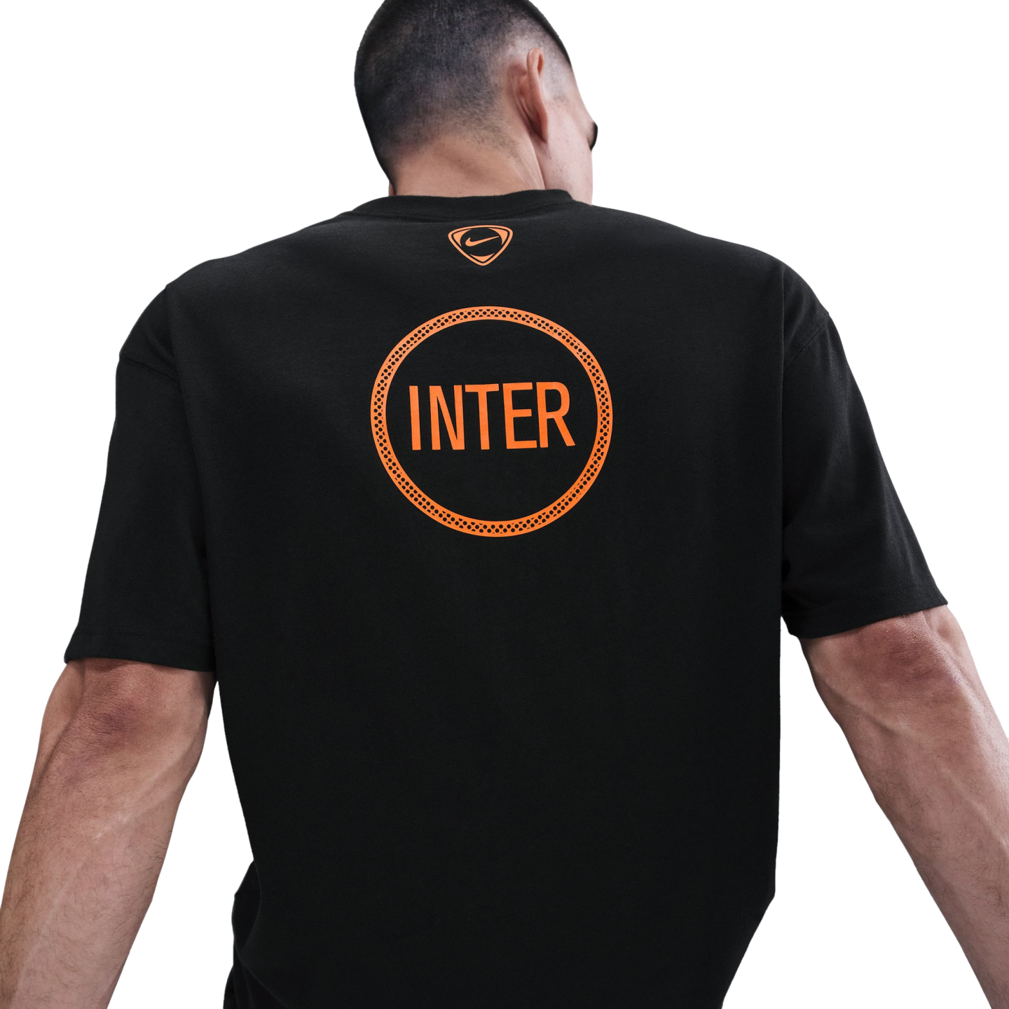 Back view of a man wearing a black Nike t-shirt with a large orange "INTER" graphic inside a circle and a small orange Nike logo at the neckline.