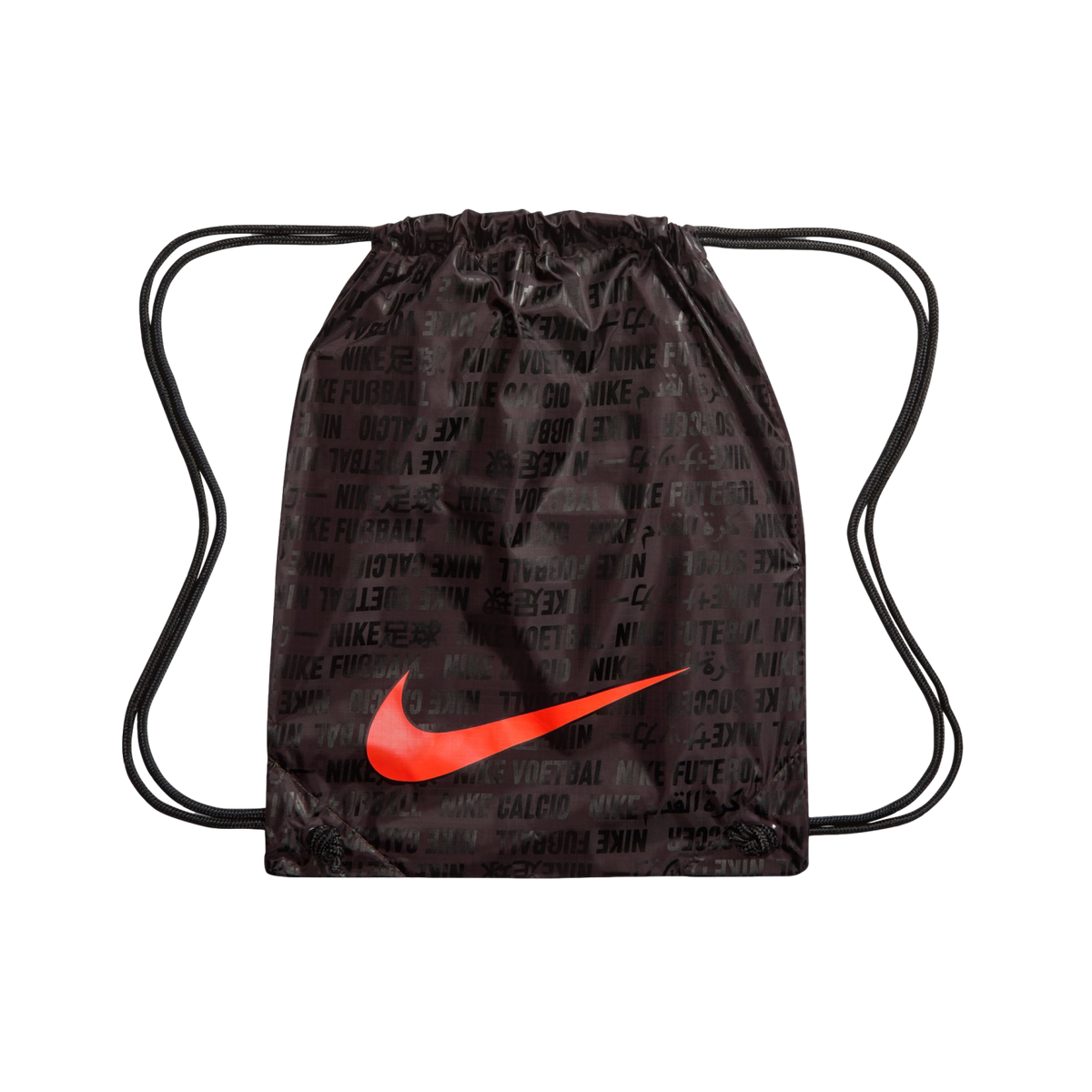 A dark brown Nike drawstring bag featuring a large, bright red swoosh across the center. The bag is covered in a repeating black text pattern of "NIKE" followed by translations for the word "football" in various languages and scripts. Black cord drawstrin