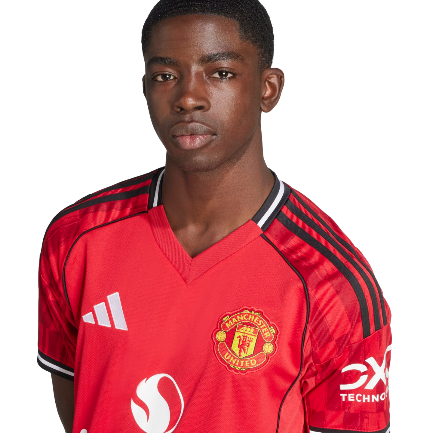 Studio portrait of a young Black man wearing a red Manchester United football jersey against a white background.