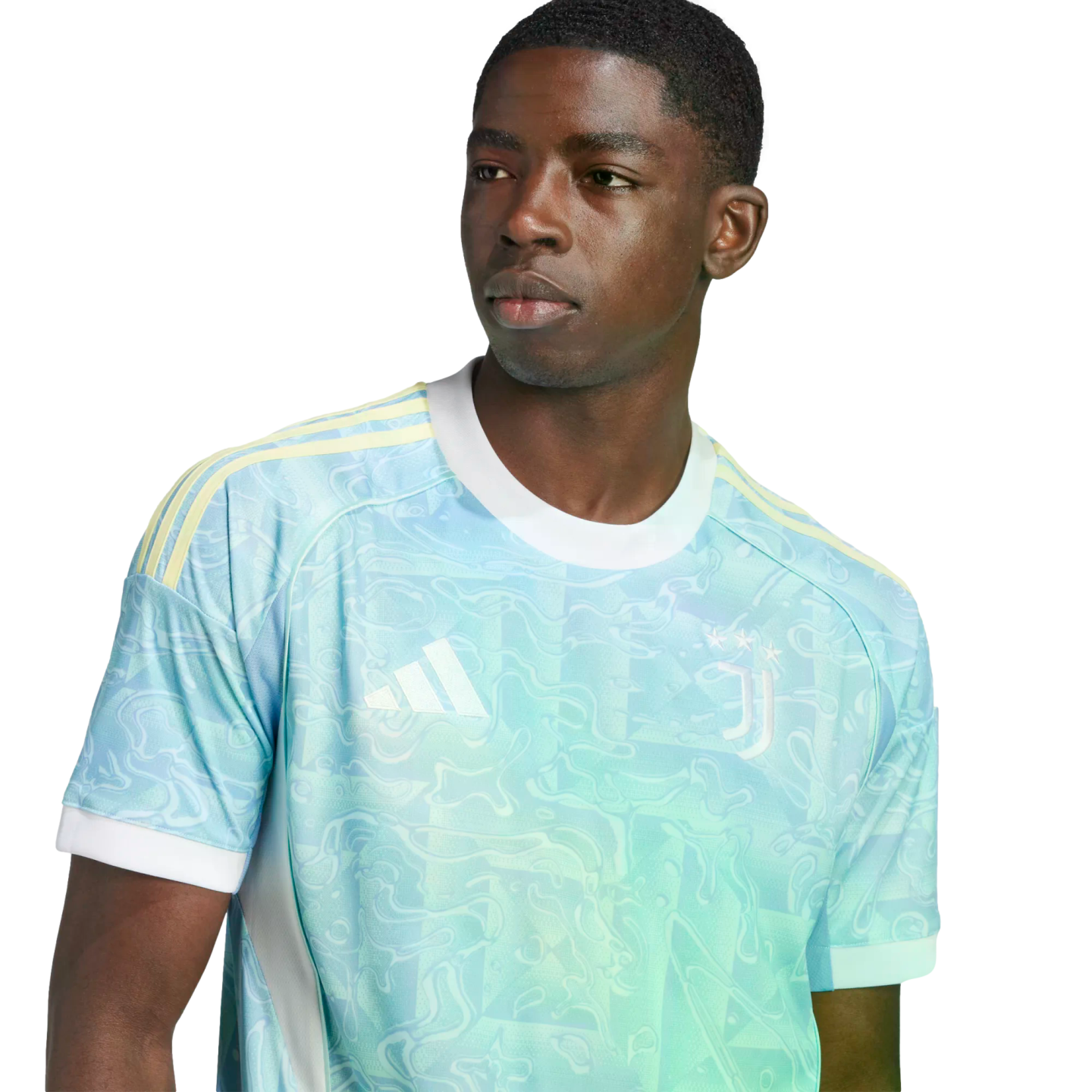 A young man wearing a light blue and teal patterned Juventus soccer jersey with yellow shoulder stripes and a white collar.