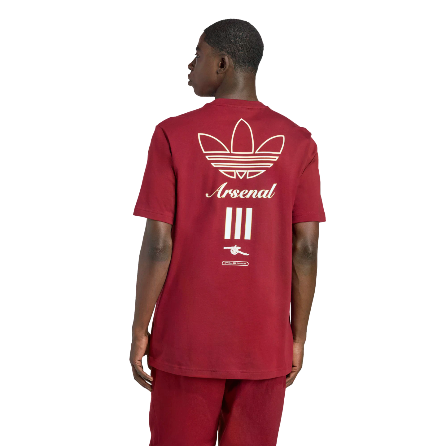 Rear view of a man in a maroon Adidas t-shirt featuring an off-white trefoil logo, "Arsenal" script, three vertical bars, and a cannon emblem.