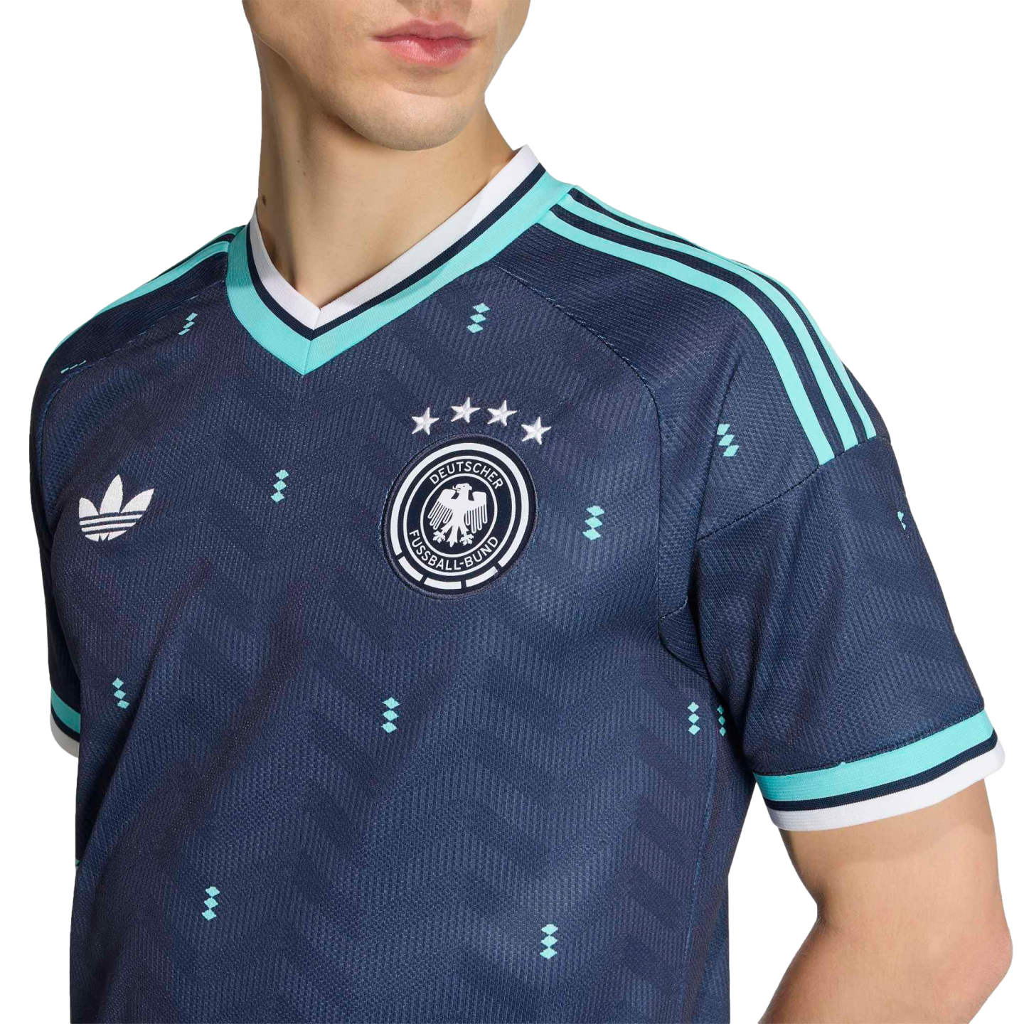 Navy blue Germany football jersey with teal accents, featuring the DFB crest, Adidas trefoil logo, and small diamond patterns.