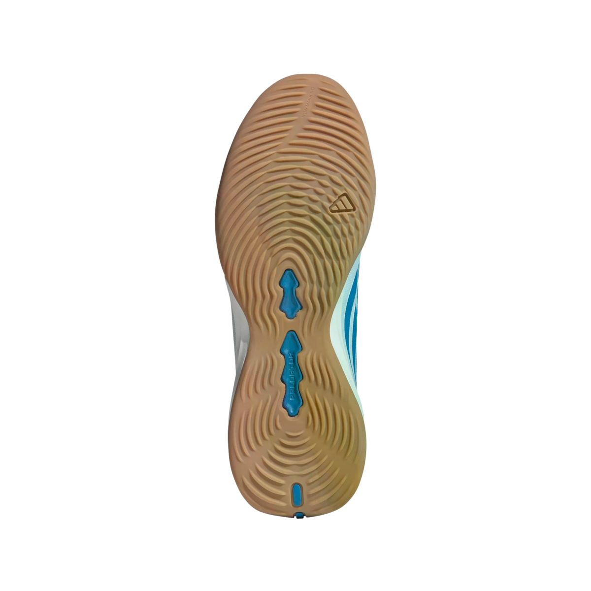 A gum-colored rubber sole of an Adidas Predator shoe with concentric circular tread patterns and blue inserts, shown against a solid black background.