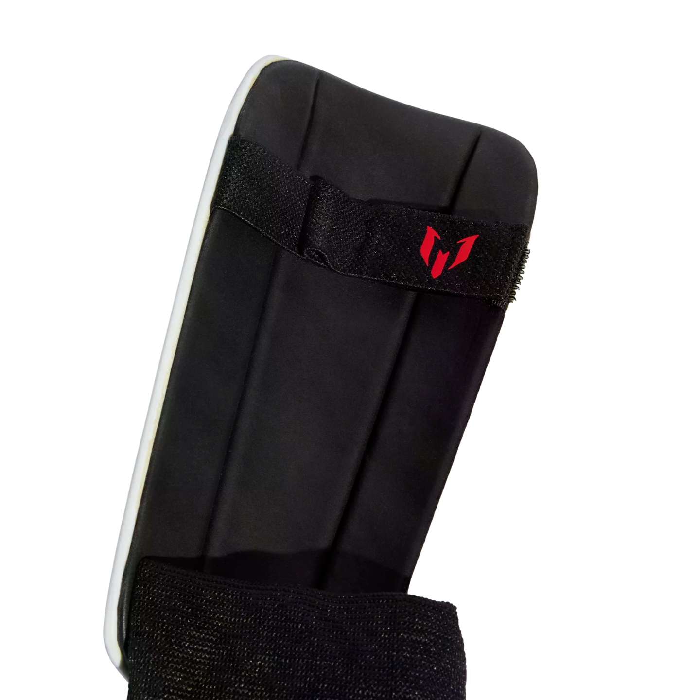 A back view of a black foam-padded shin guard with a white outer shell edge and black elastic straps, the top strap featuring a red logo.