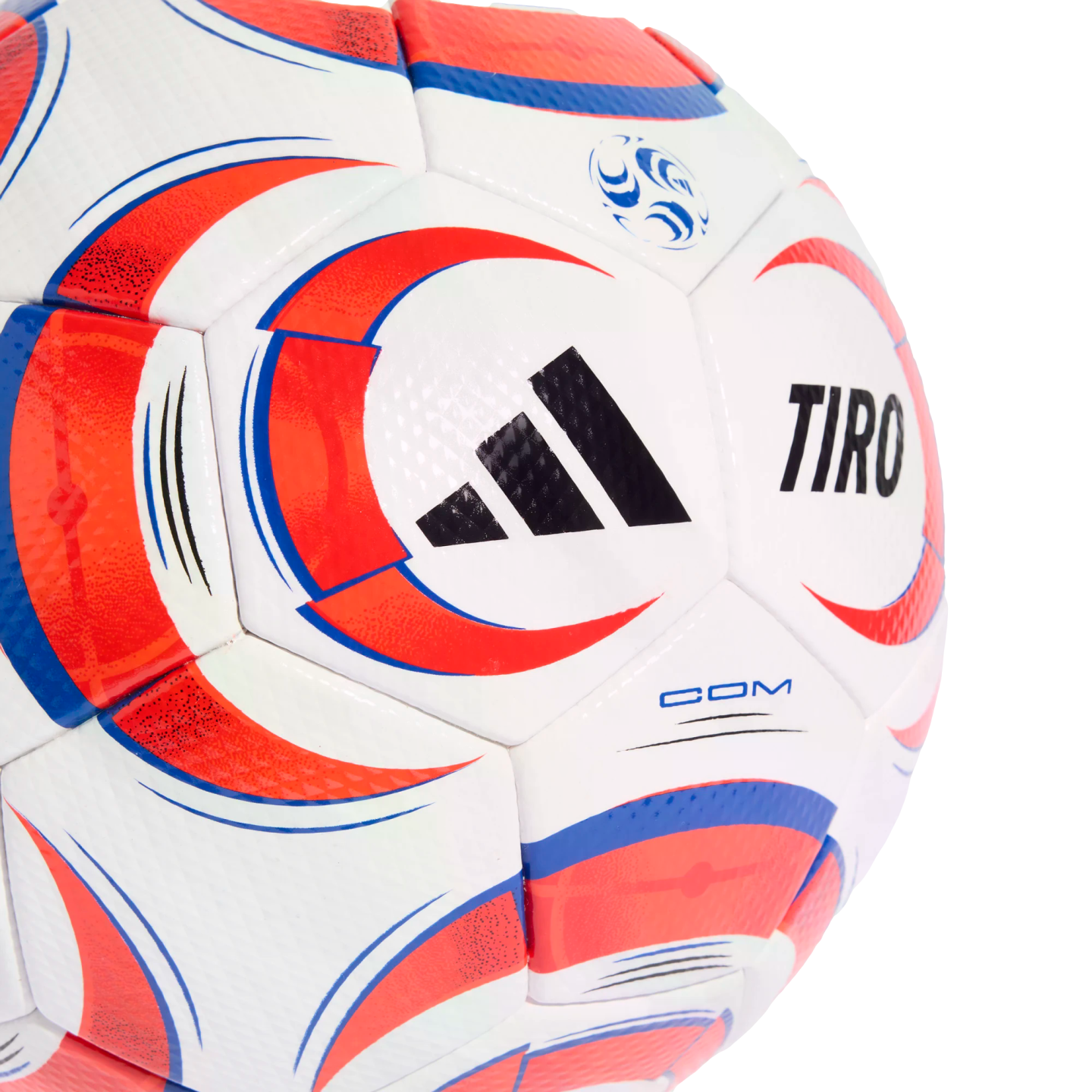 Close-up of a white Adidas Tiro soccer ball with red and blue graphic patterns against a black background.