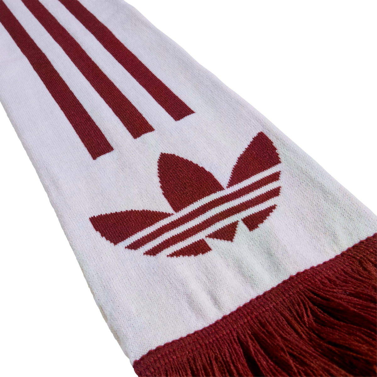 A knitted white scarf featuring a maroon Adidas Trefoil logo and three stripes, with matching burgundy fringe at the bottom.