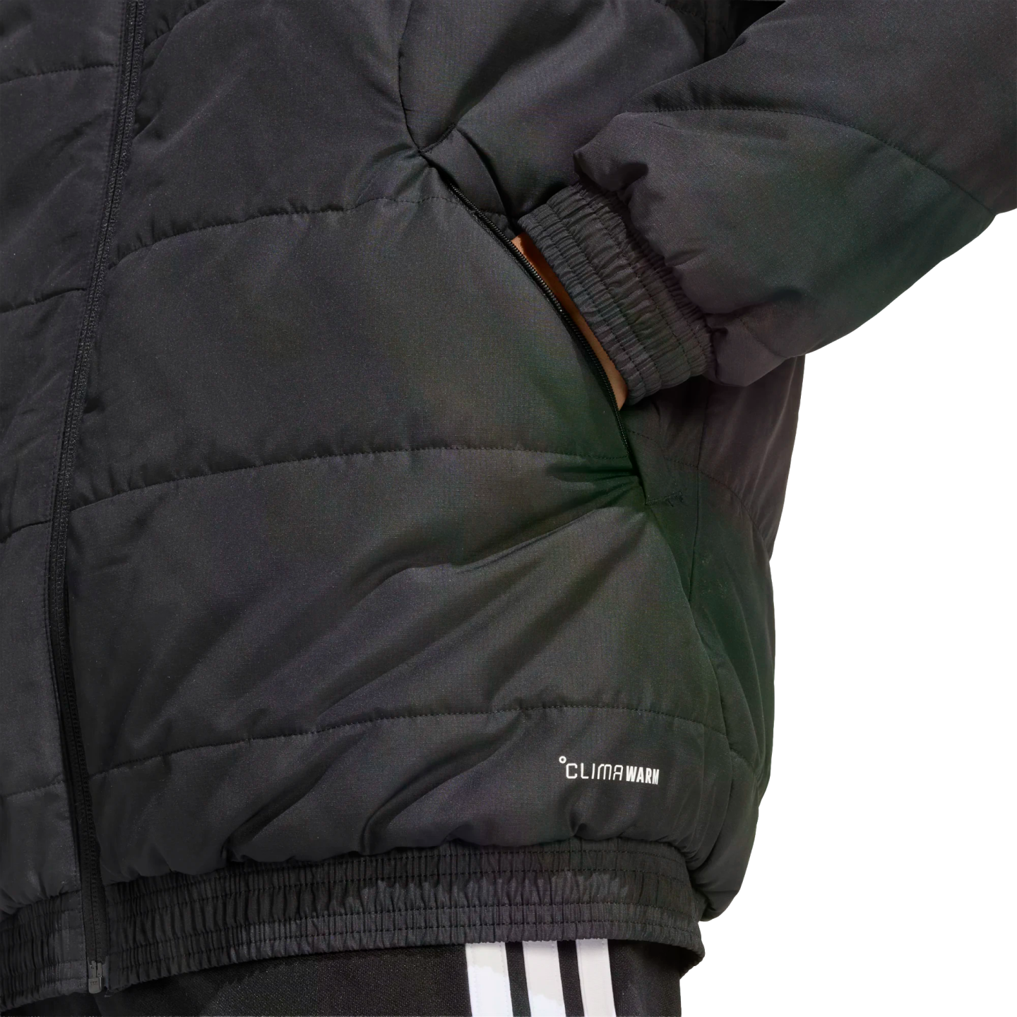 Close-up of a black quilted jacket featuring a hand in the pocket, ribbed hem and cuffs, and "CLIMAWARM" branding. White-striped pants are partially visible at the bottom.