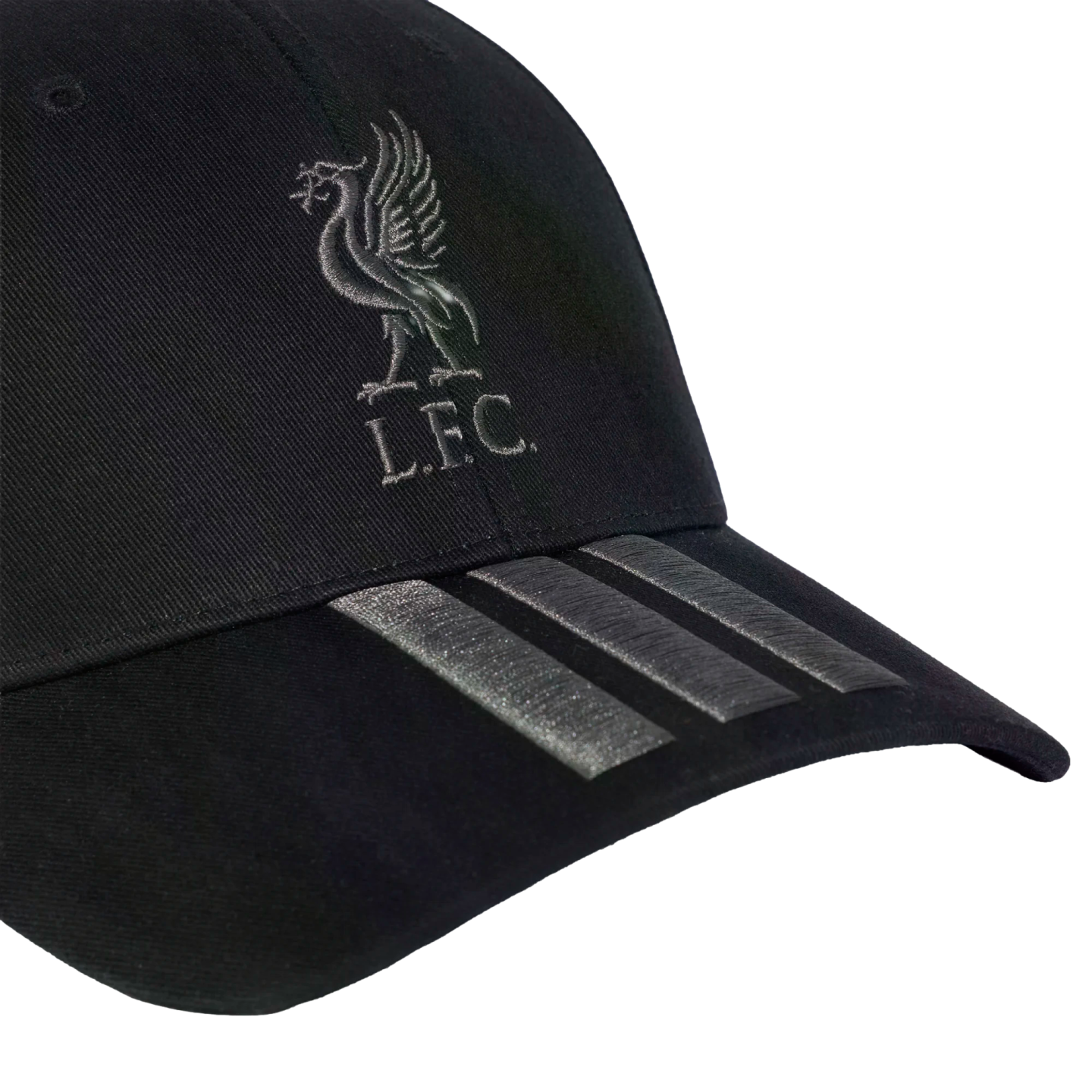 A black baseball cap featuring a silver Liverpool FC crest on the front and three silver Adidas stripes on the brim.