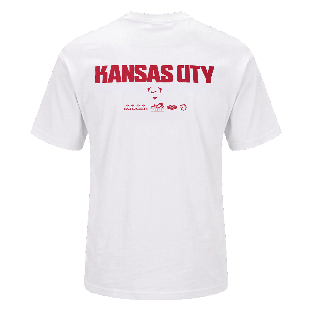 Back view of a white Nike t-shirt with "KANSAS CITY" and small sports logos printed in red on the upper back.