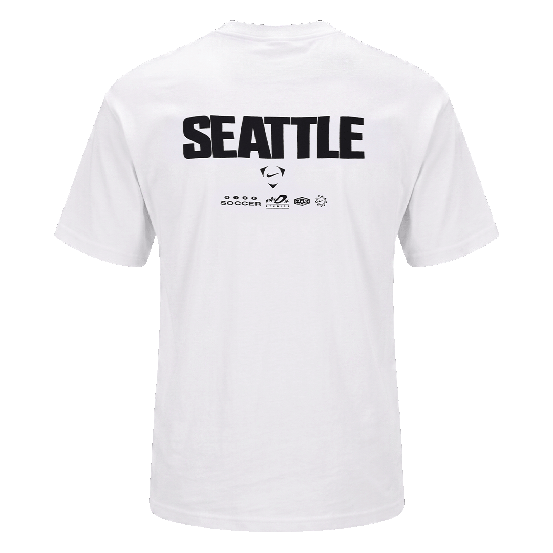 The back of a white t-shirt featuring "SEATTLE" in large black letters above smaller brand logos, including Nike Soccer.