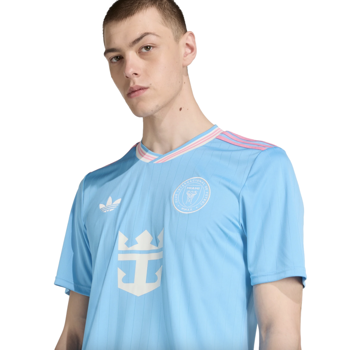 Man wearing a light blue Inter Miami CF third jersey with pink and white trim and Royal Caribbean sponsor logo.
