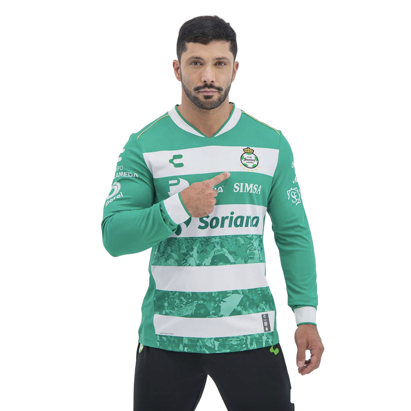 Man in a green and white striped Santos Laguna soccer jersey pointing to the team's crest on his chest against a black background.