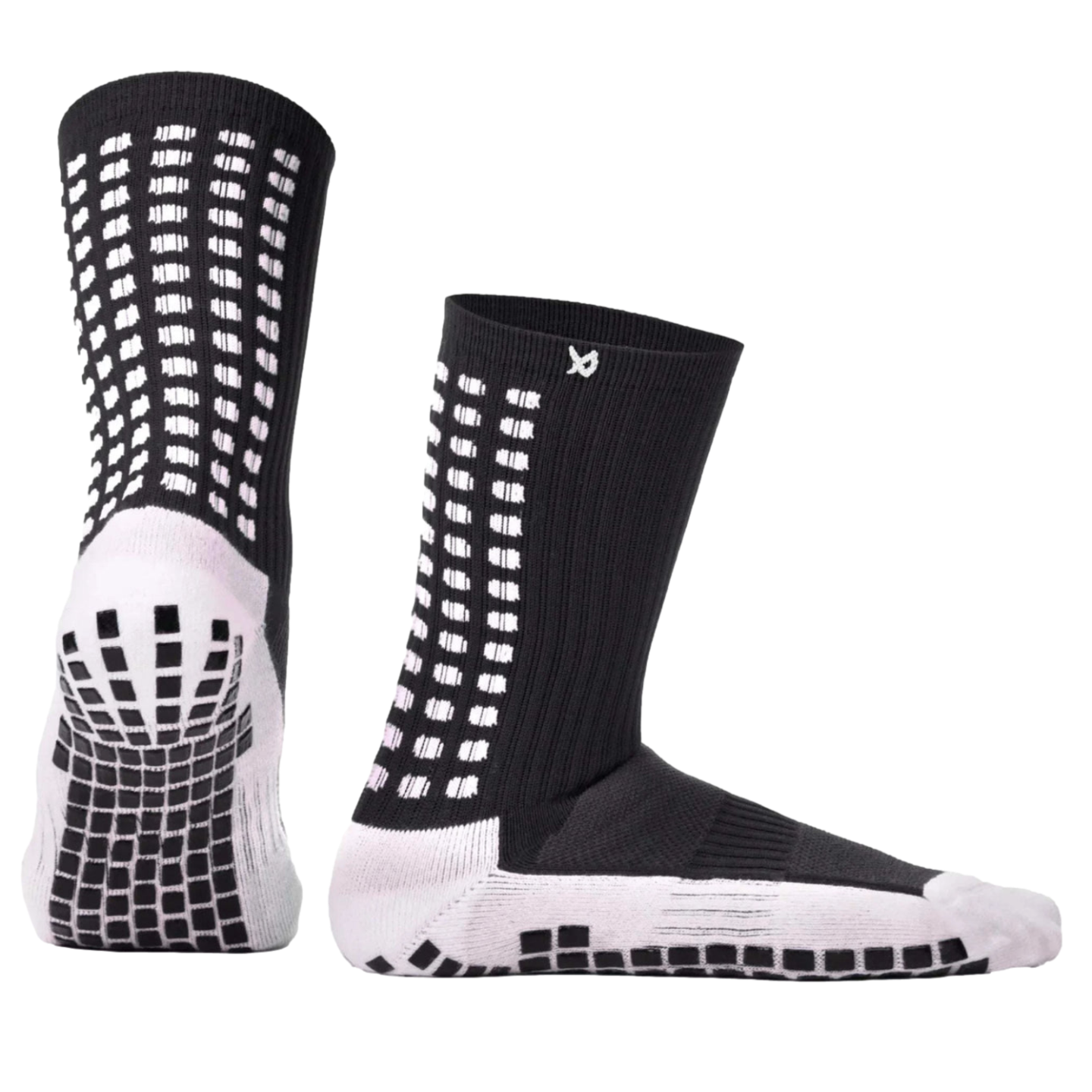 A pair of black and white crew socks with non-slip traction pads on the soles and white geometric designs on the ankles.