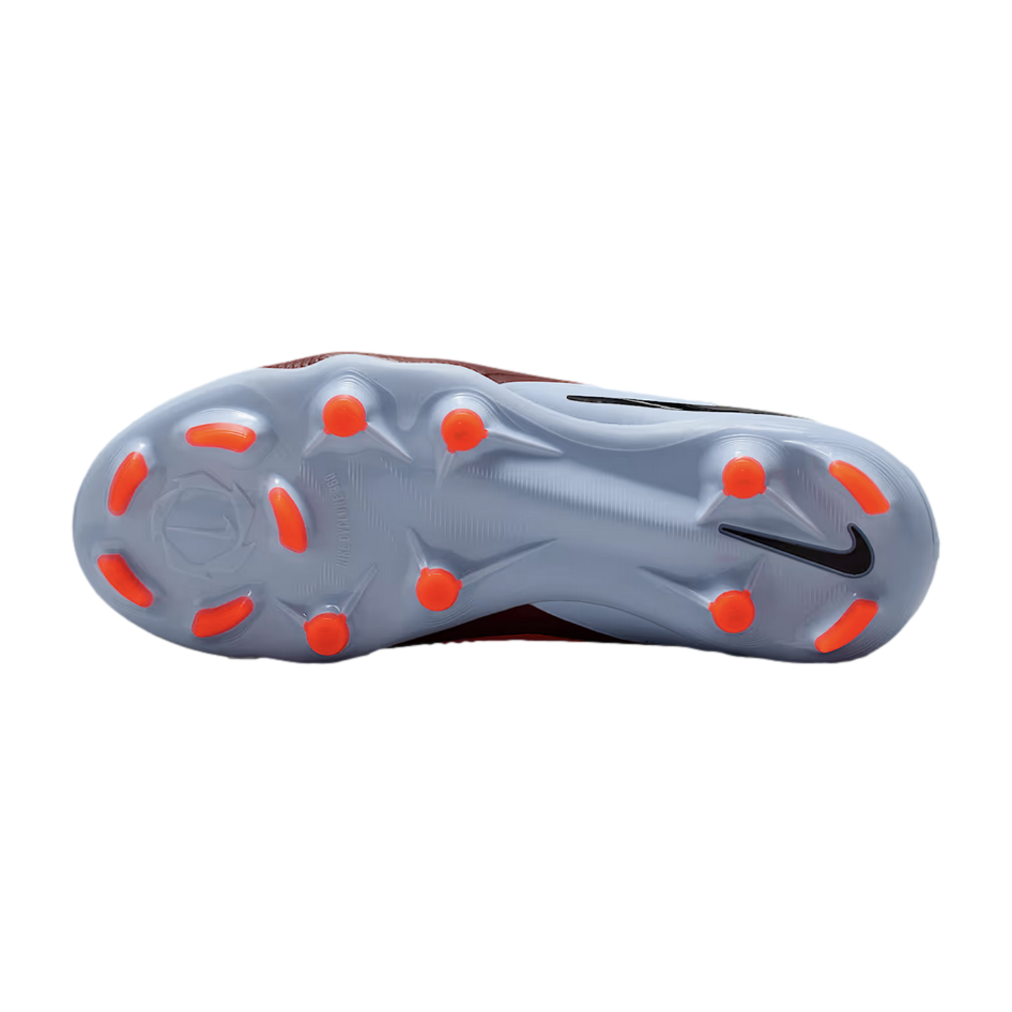 Bottom view of a light blue Nike soccer cleat with orange studs against a black background.