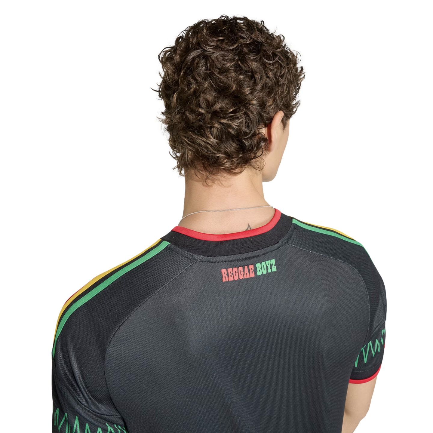 Back view of a person wearing a black Jamaica soccer jersey with "REGGAE BOYZ" text and red, yellow, and green accents on the shoulders.