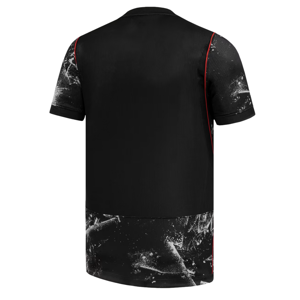 A back view of a black short-sleeved jersey with white splatter patterns on the sleeves and bottom hem, accented by thin red piping along the seams.