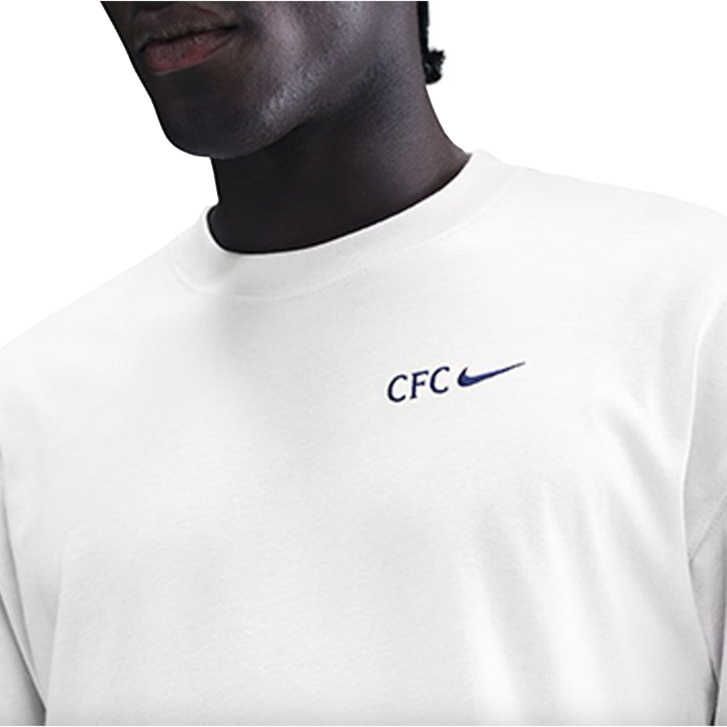 A person wearing a white T-shirt with a blue "CFC" text and Nike swoosh logo on the left chest.