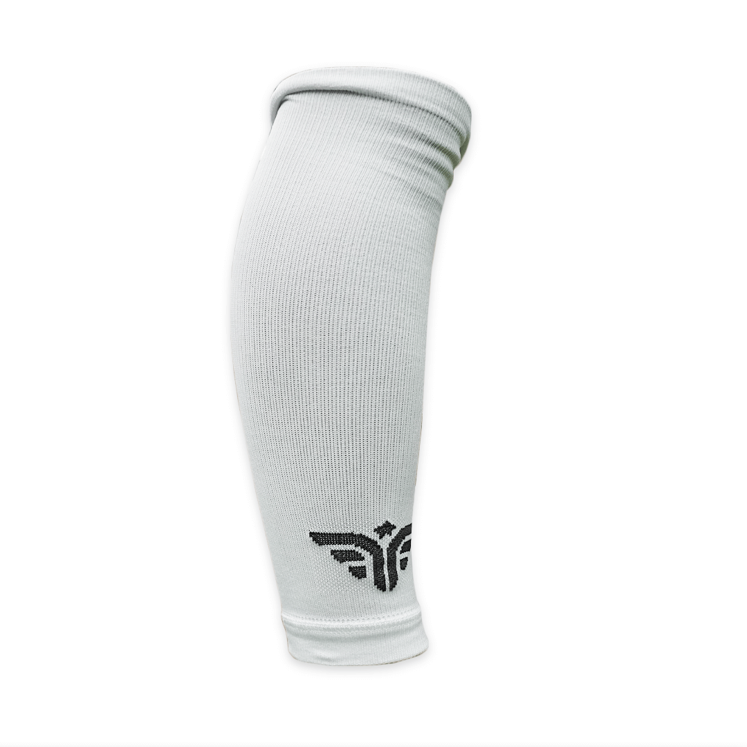 A white For The Footballer XLR8R Regular Leg Sleeve shown from a side profile against a white background, featuring a black winged logo near the bottom cuff.