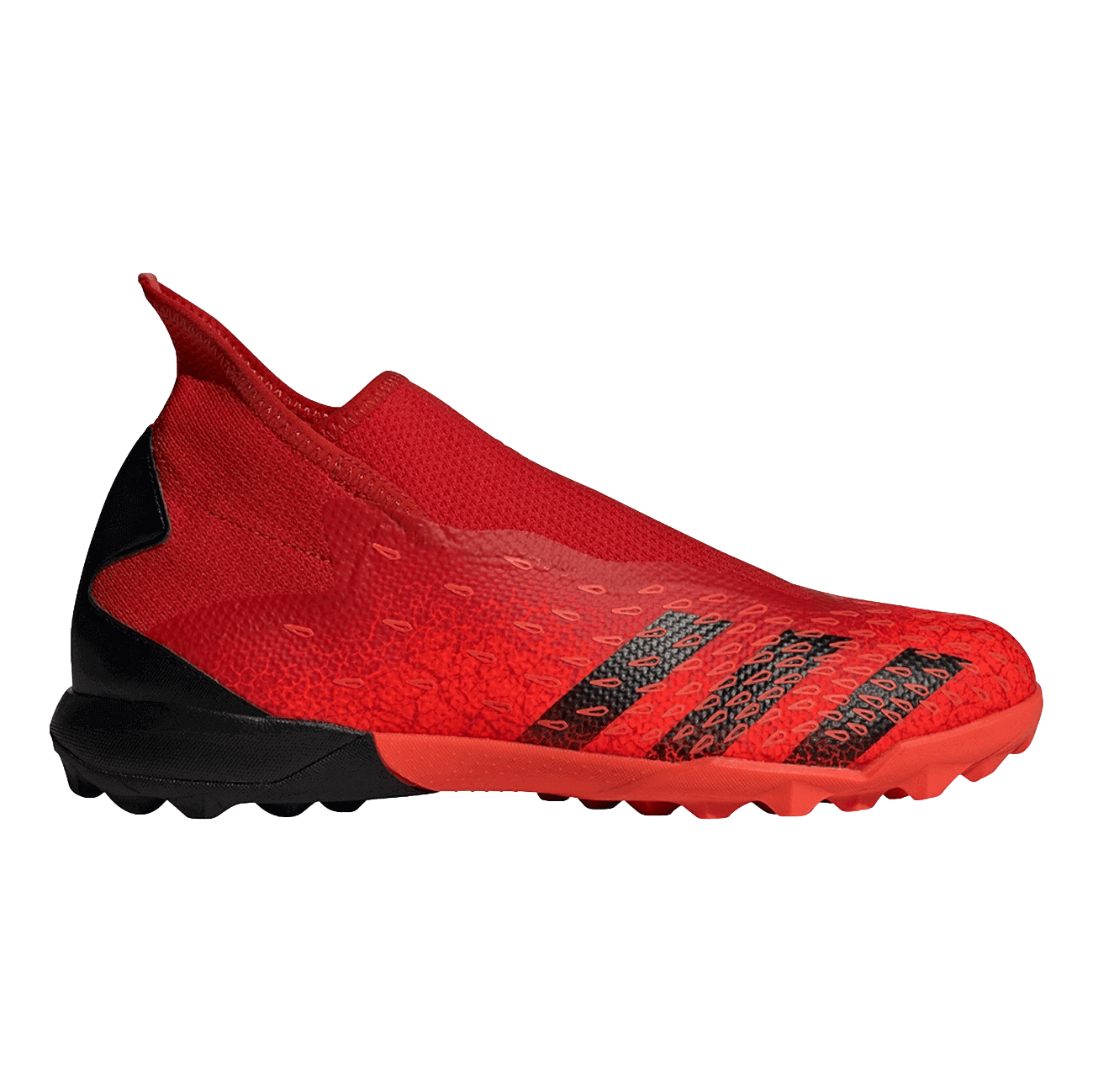 A red and black laceless Adidas Predator turf soccer shoe featuring a textured upper and a high-top collar.