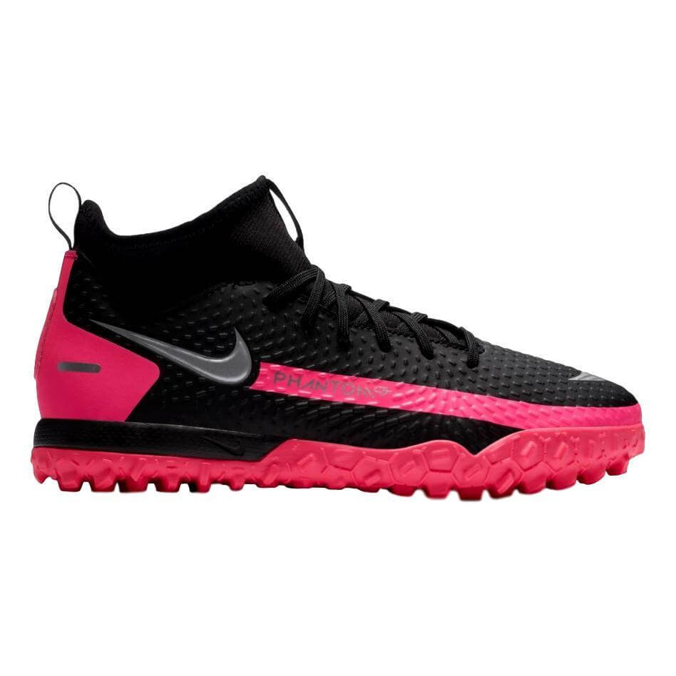 Black Nike Phantom turf soccer shoe with pink accents and a textured pink sole, shown from a side profile on a white background.