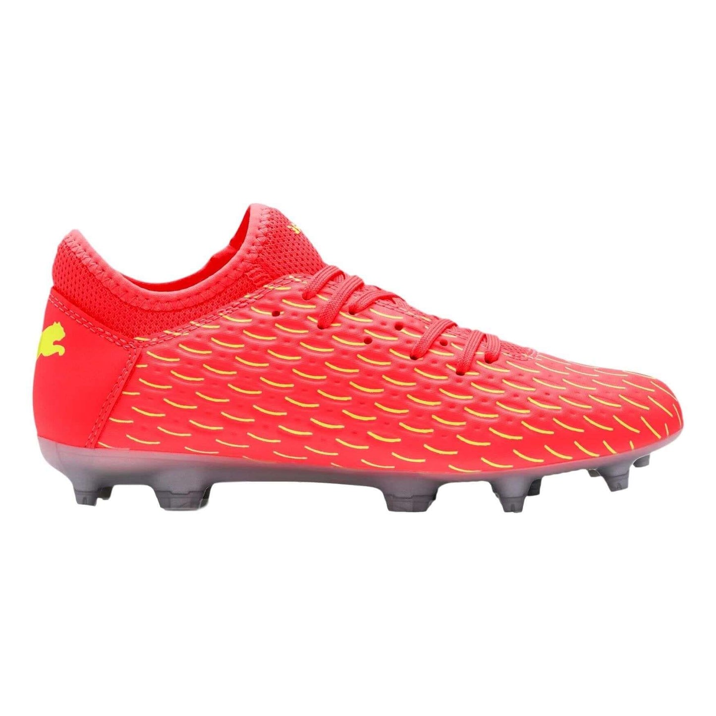 Side profile of a red Puma soccer cleat with yellow textured patterns and a grey studded sole against a white background.