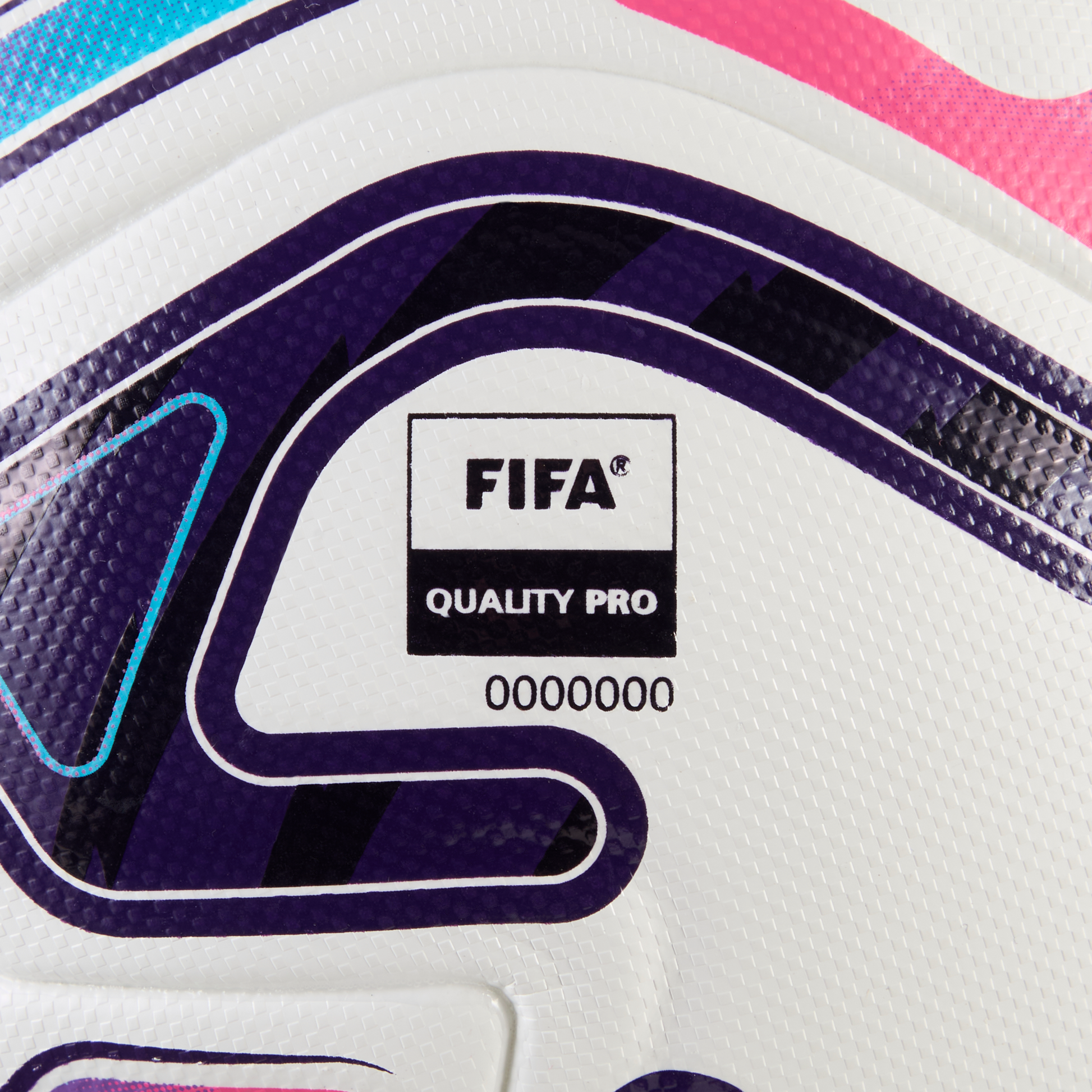 Close-up of a white soccer ball with purple and pink accents, featuring the FIFA Quality Pro logo and the serial number 0000000.
