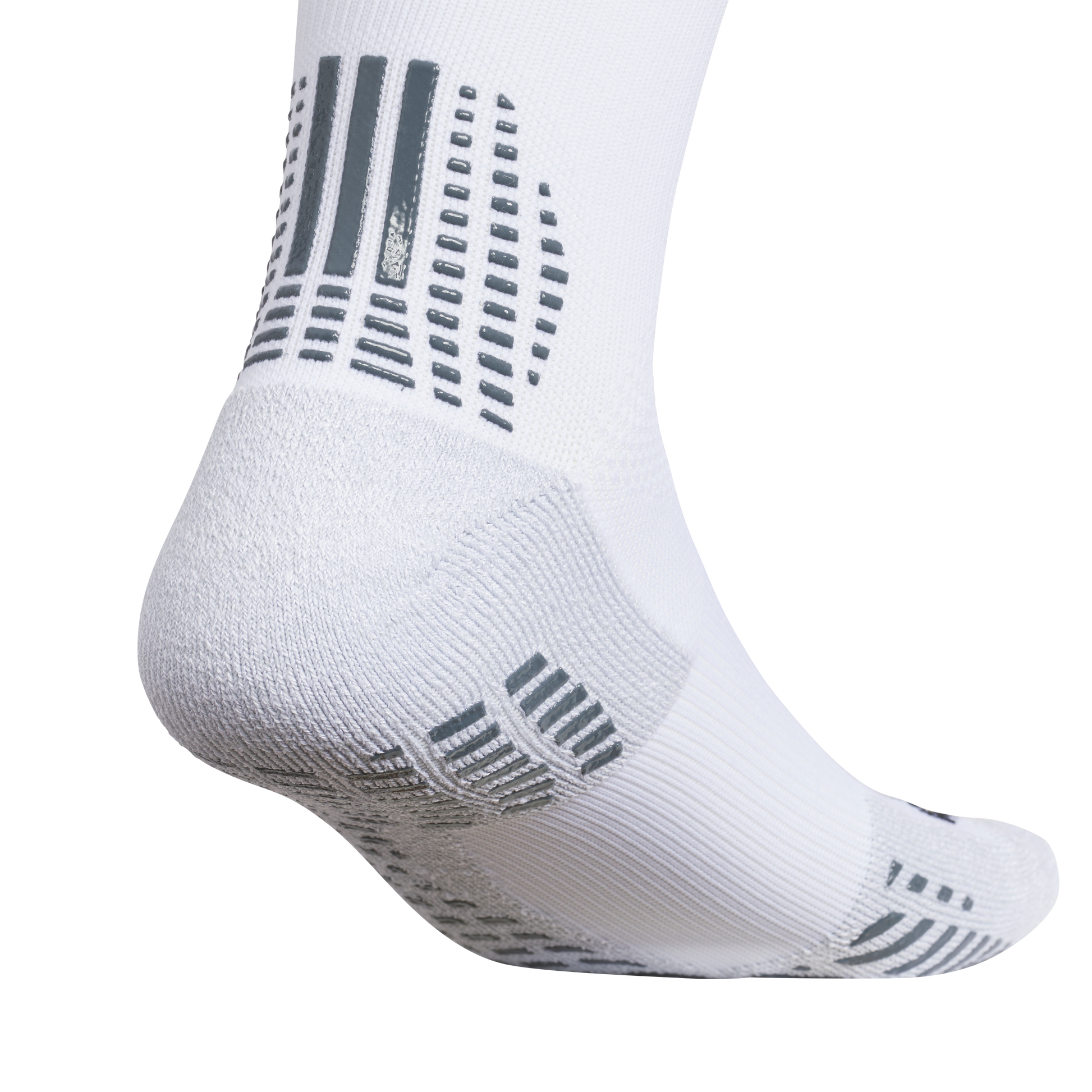 Close-up of a white performance sock with grey rubberized grip patterns on the heel and sole for traction.