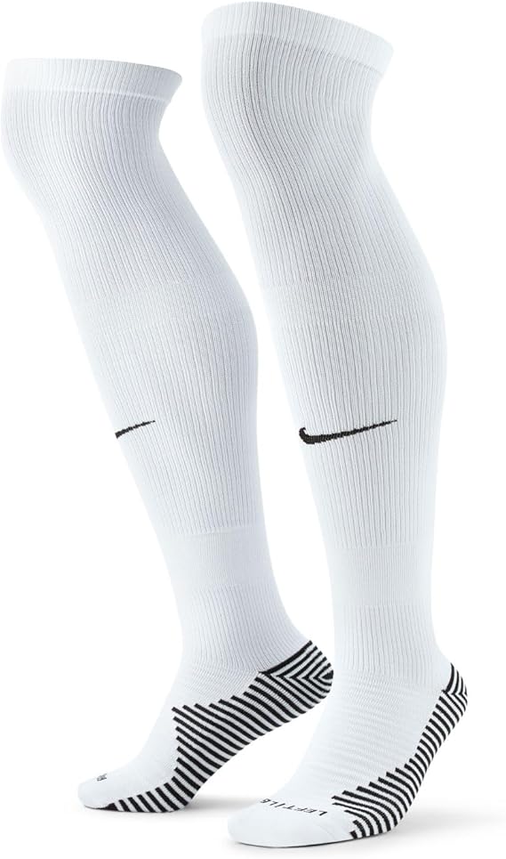 A pair of white Nike knee-high athletic socks featuring black swooshes on the shins and black-and-white striped grip patterns on the heels and soles.