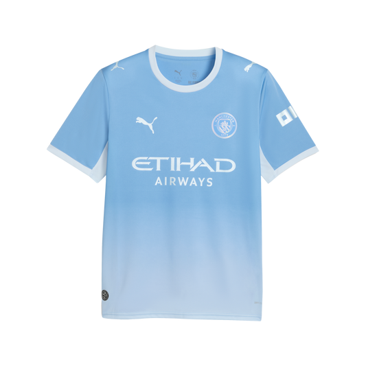 A light blue Manchester City home jersey with white trim, featuring the team crest, Puma logo, and Etihad Airways sponsor against a subtle blue gradient.