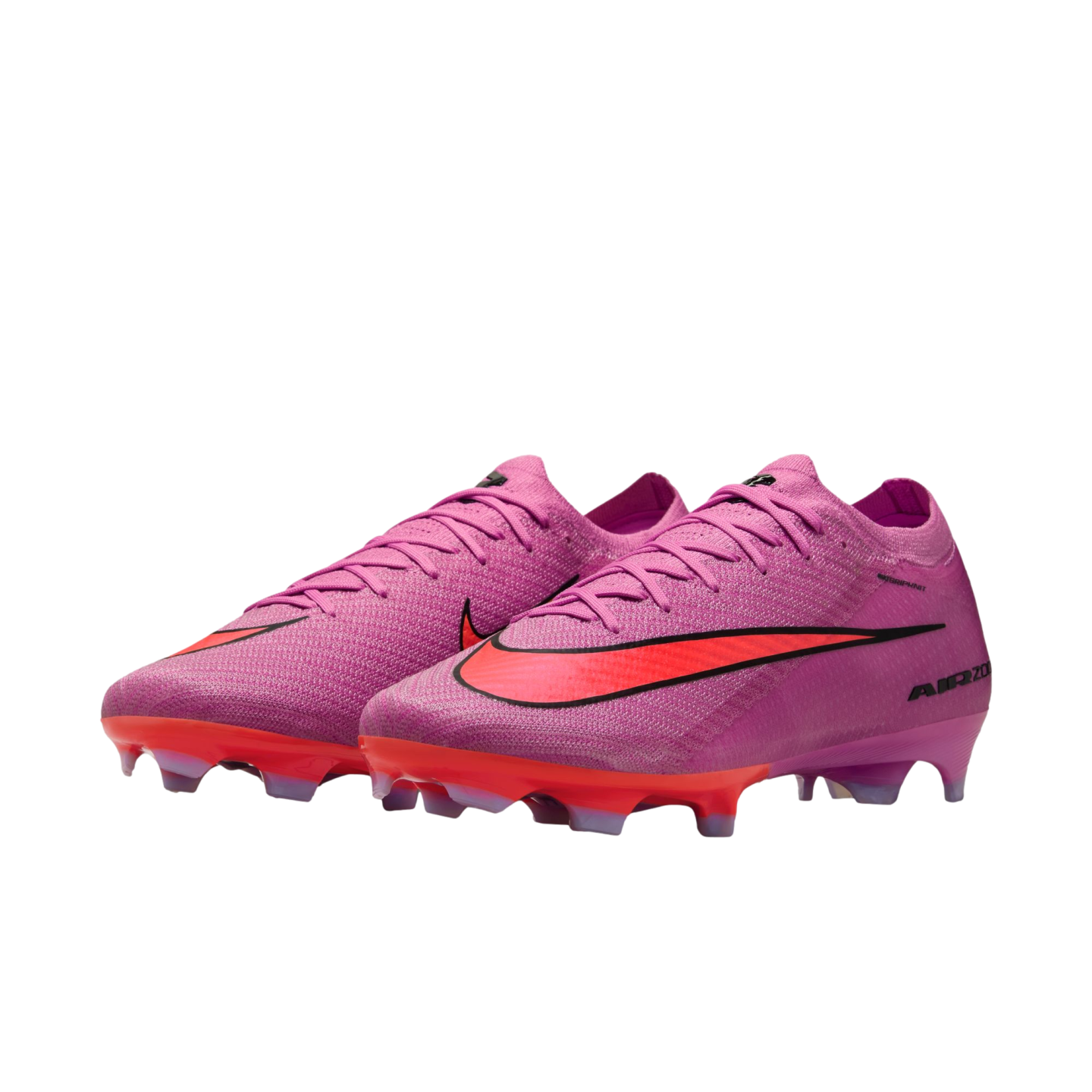 Pair of pink Nike Air Zoom soccer cleats with a vibrant red swoosh and sole plate, isolated on a black background.