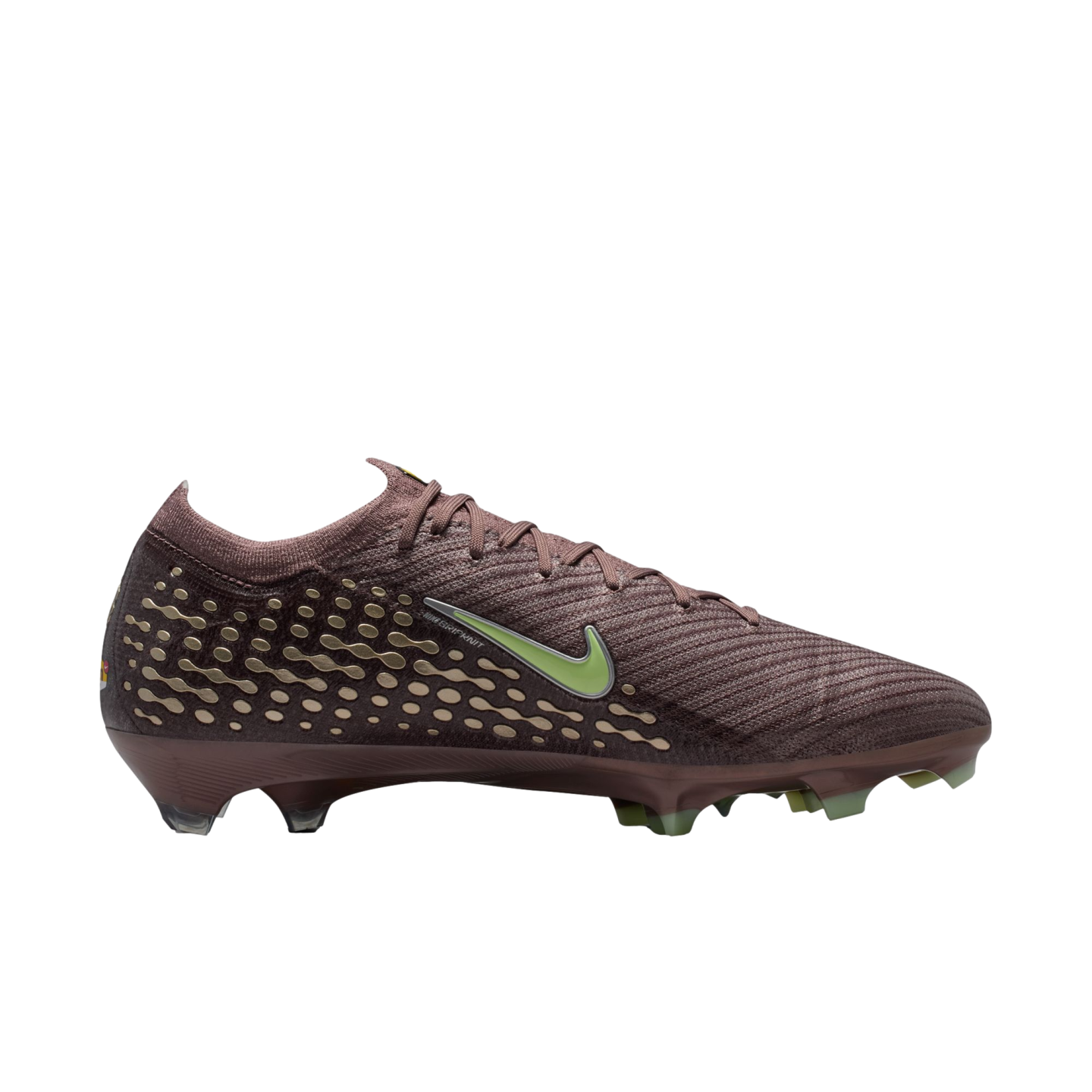 Side view of a maroon Nike soccer cleat with a lime green swoosh and gold patterned accents on the heel, set against a black background.