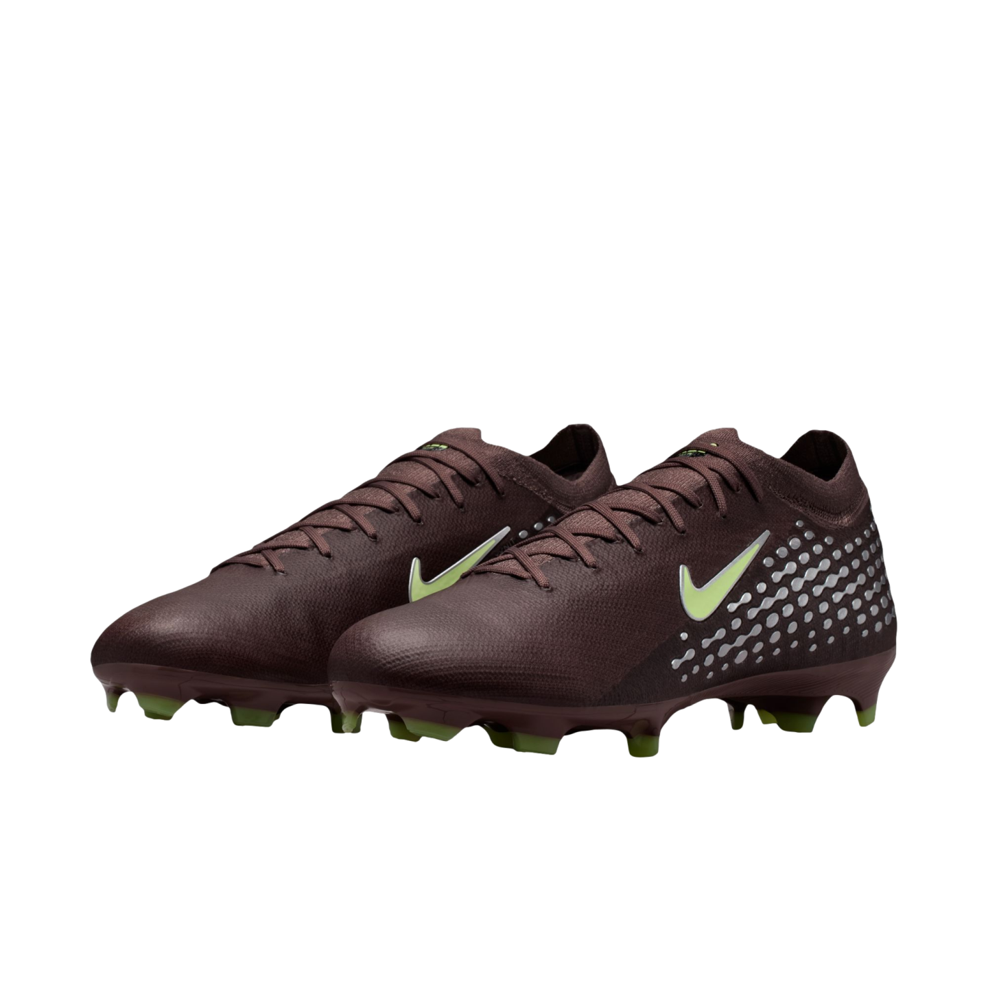 A pair of dark brown Nike soccer cleats with lime green accents and a silver dot pattern on the heel, set against a black background.