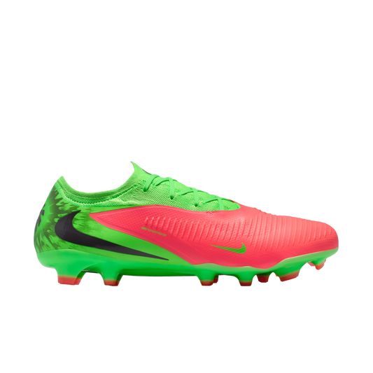 A profile view of a Nike soccer cleat in neon green and bright pink, featuring a large black swoosh on the side, set against a black background.