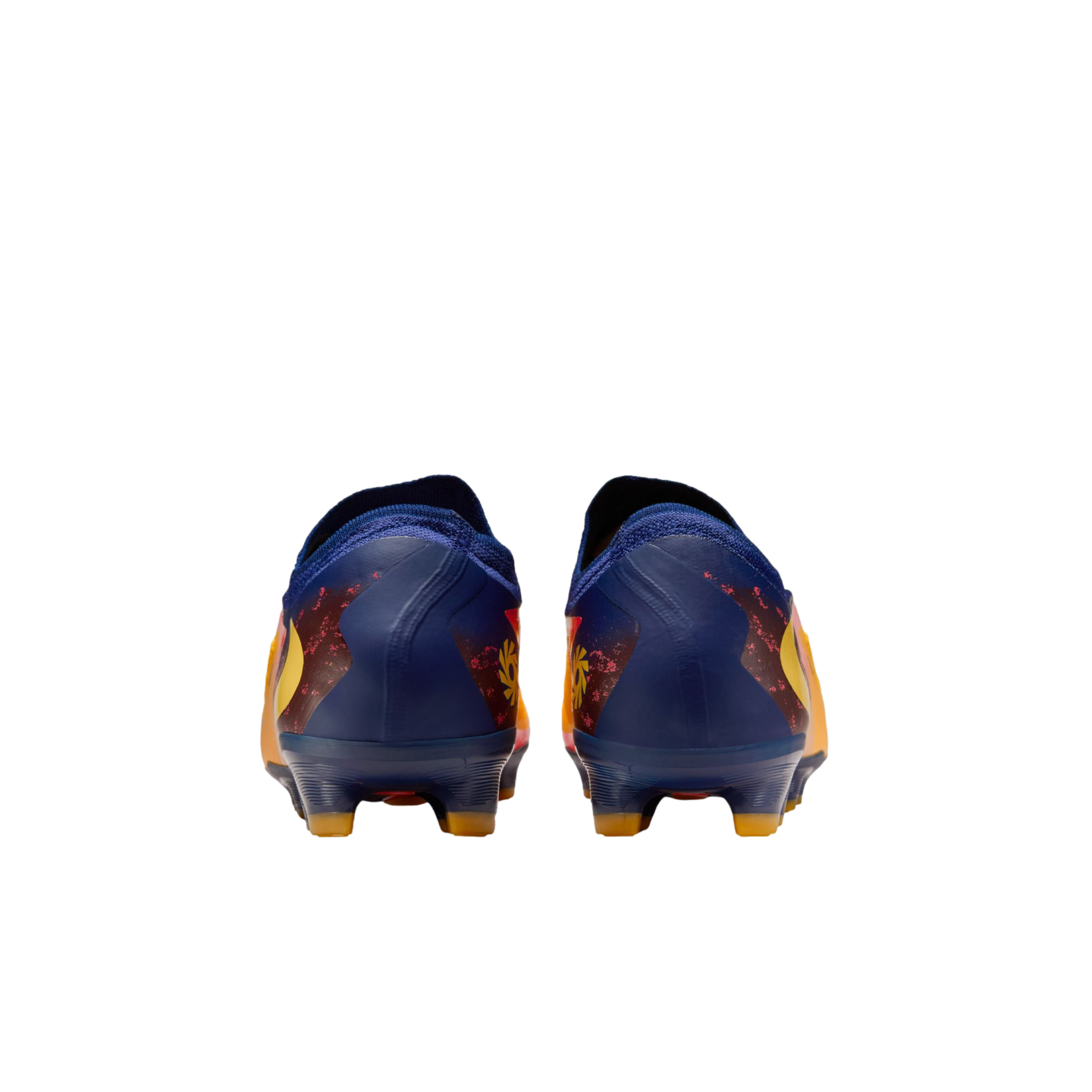 Rear view of a pair of dark blue soccer cleats with vibrant yellow and orange designs, set against a solid black background.