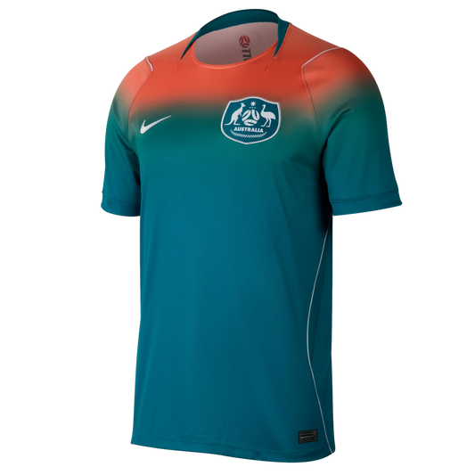 A Nike Australia soccer jersey featuring a bright orange to teal color gradient from the shoulders down. It displays the Australian national team crest on the left chest and a white Nike swoosh on the right.