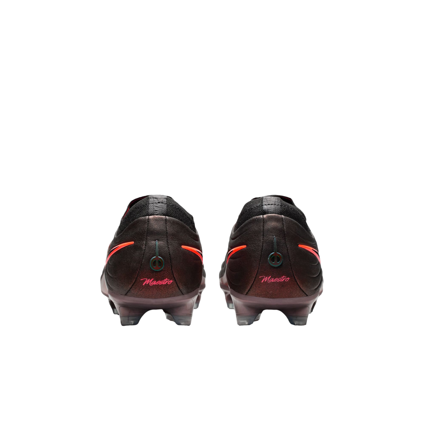Rear view of dark soccer cleats with "Maestro" in pink script and orange accents on the heels, set against a black background.