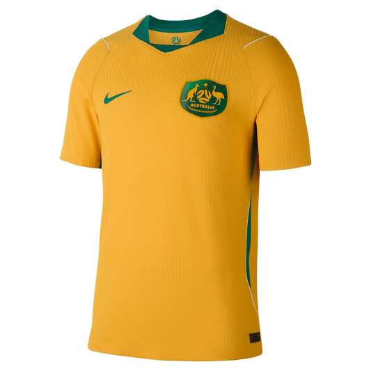 Gold Australia national football team home jersey with green collar, Nike swoosh, and team crest.