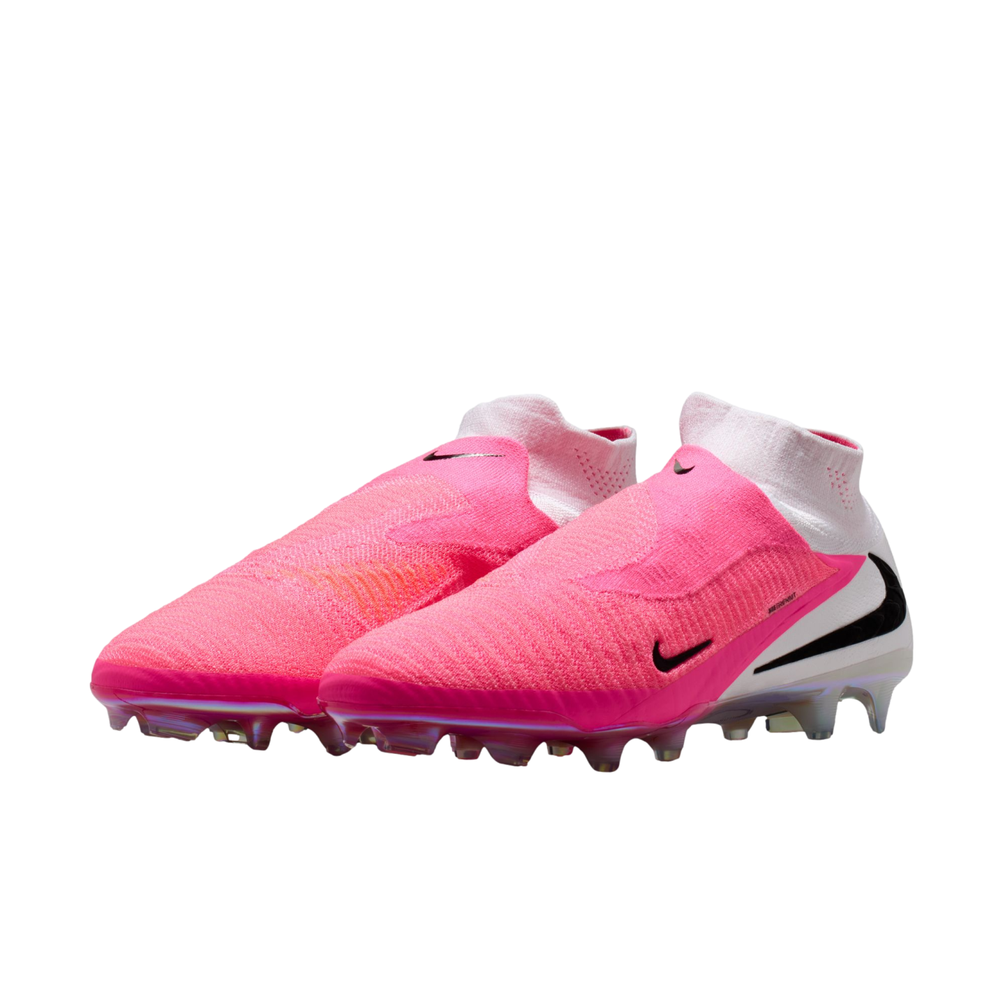 A pair of vibrant pink and white Nike soccer cleats with black swoosh logos and iridescent soleplates, set against a plain white background.