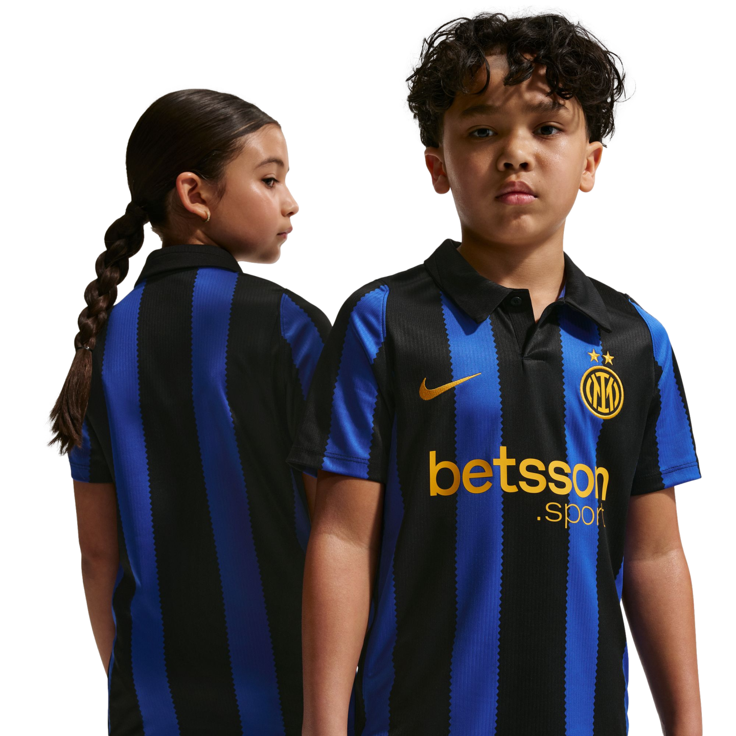 Two children model the black and blue striped Inter Milan home jersey with gold logos, showing both front and back views against a white background.