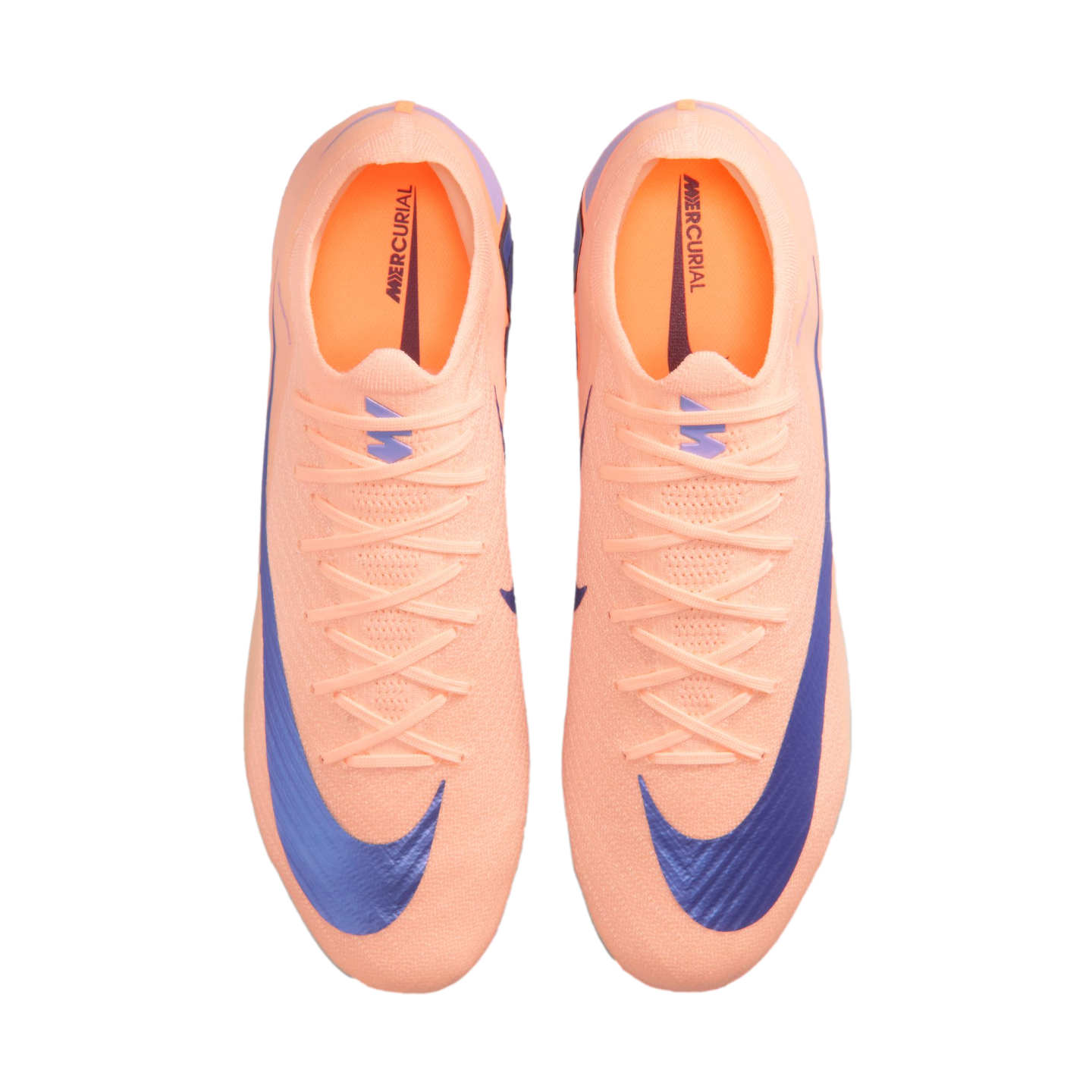 Top-down view of a pair of bright peach Nike Mercurial soccer cleats with large purple swooshes, displayed against a solid black background.