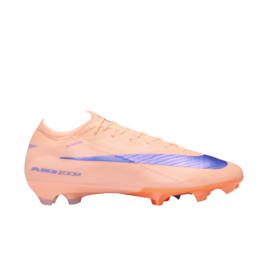 Peach Nike soccer cleat with a large purple swoosh and "AIR ZOOM" text on the heel, shown in a side profile against a black background.