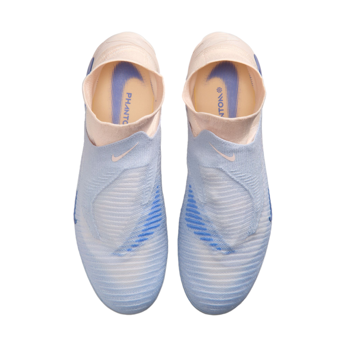 Top-down view of light blue and pale pink laceless Nike Phantom soccer cleats against a solid black background.