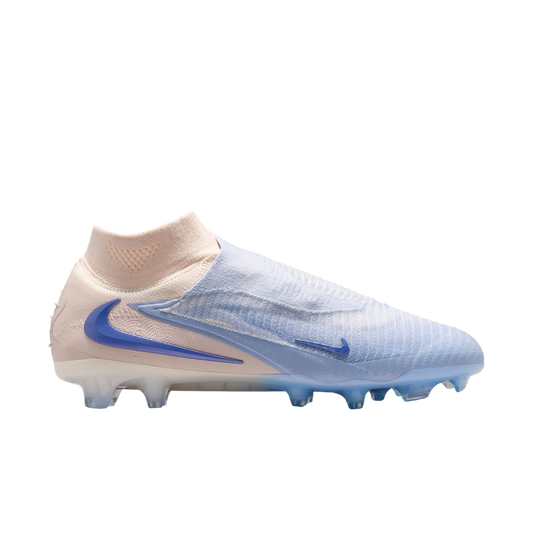 A side view of a Nike Phantom soccer cleat in pale pink and light blue with a sock-like collar and blue swooshes, set against a black background.
