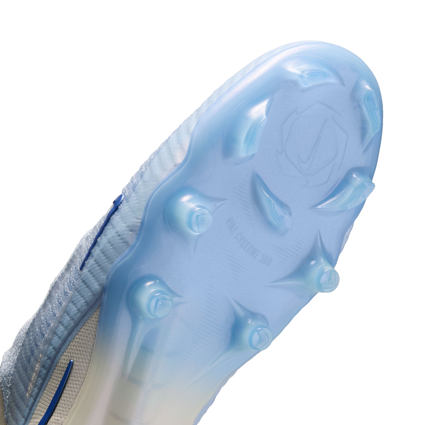 The underside of a light blue Nike soccer cleat showing the "NIKE CYCLONE 360" soleplate and stud pattern against a black background.