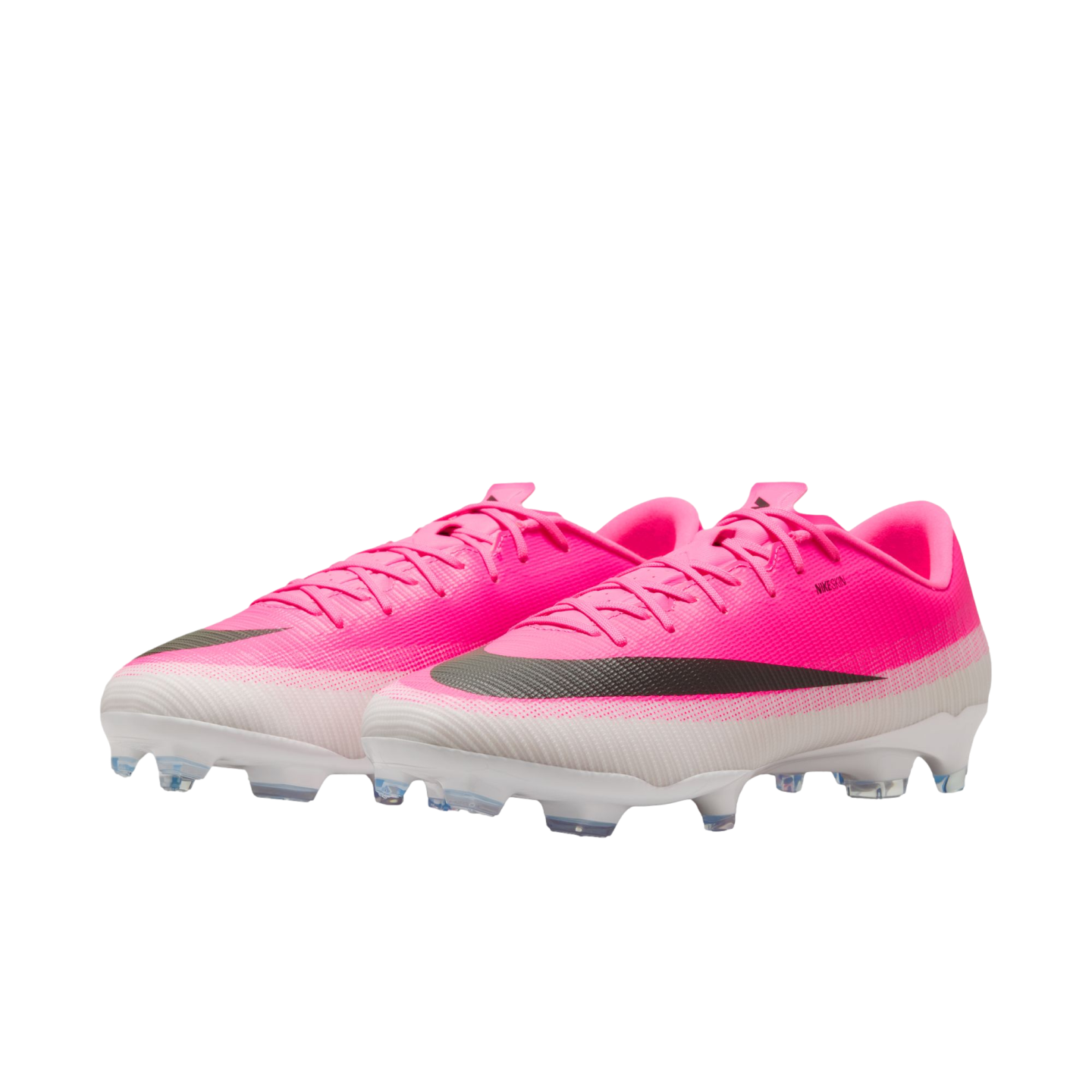A pair of bright pink and white Nike soccer cleats with a black swoosh, positioned against a plain white background.