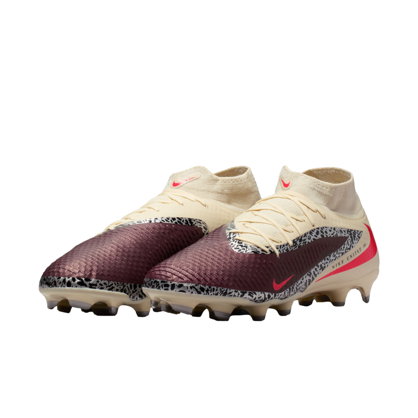 Nike United soccer cleats with maroon and cream uppers, black and white safari print accents, and pink Nike swooshes.